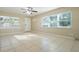 Bright living room with tile floors and ceiling fan at 2913 E Howell St, Tampa, FL 33610