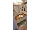 Bathroom featuring vanity with generous countertop space and beach themed decor at 906 Bluewater Dr, Sun City Center, FL 33573