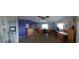 Spacious bedroom with a purple accent wall, ceiling fan, and lots of natural light from a window at 906 Bluewater Dr, Sun City Center, FL 33573