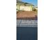 Paver driveway leading to a two-car garage, enhancing curb appeal and functionality at 906 Bluewater Dr, Sun City Center, FL 33573