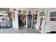 Organized garage featuring tool storage and a variety of wall decorations at 906 Bluewater Dr, Sun City Center, FL 33573