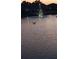 Lake view featuring an illuminated fountain at 906 Bluewater Dr, Sun City Center, FL 33573