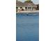 Lake view featuring an illuminated fountain at 906 Bluewater Dr, Sun City Center, FL 33573