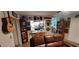 Cozy living area featuring comfortable seating, a counter to the kitchen, and decorative wall art at 906 Bluewater Dr, Sun City Center, FL 33573