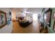 Large living room with ceiling fan, tile flooring, and mermaid decorations at 906 Bluewater Dr, Sun City Center, FL 33573