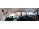Sun room with seating area offers waterfront views and an abundance of light at 906 Bluewater Dr, Sun City Center, FL 33573