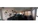 Spacious sunroom with comfortable seating and views of the lake at 906 Bluewater Dr, Sun City Center, FL 33573
