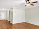 Living room with light walls, wood flooring and ceiling fan at 922 Wynnmere Walk Ave, Ruskin, FL 33570