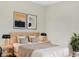 Main bedroom with light walls, a platform bed, and stylish decor at 922 Wynnmere Walk Ave, Ruskin, FL 33570