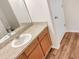 Clean bathroom with wood vanity, single sink, and neutral tones at 922 Wynnmere Walk Ave, Ruskin, FL 33570