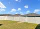Large backyard with a vinyl fence and grassy area at 922 Wynnmere Walk Ave, Ruskin, FL 33570