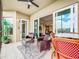 Relaxing balcony with patio furniture and view of the community at 10530 Boardwalk Loop # 304, Lakewood Ranch, FL 34202