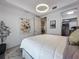 Spacious bedroom with a queen bed, walk-in closet, and artwork at 10530 Boardwalk Loop # 304, Lakewood Ranch, FL 34202