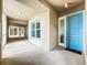 Exterior hallway view with light blue door and neutral colored walls at 10530 Boardwalk Loop # 304, Lakewood Ranch, FL 34202