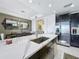 Modern kitchen with stainless steel appliances and a large island at 10530 Boardwalk Loop # 304, Lakewood Ranch, FL 34202