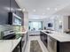 Modern kitchen with stainless steel appliances and a large island at 10530 Boardwalk Loop # 304, Lakewood Ranch, FL 34202