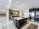 Modern kitchen with stainless steel appliances and a large island at 10530 Boardwalk Loop # 304, Lakewood Ranch, FL 34202