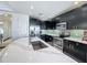 Modern kitchen with stainless steel appliances and a large island at 10530 Boardwalk Loop # 304, Lakewood Ranch, FL 34202
