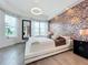 Main bedroom with a large bed, water views, and luxurious decor at 10530 Boardwalk Loop # 304, Lakewood Ranch, FL 34202