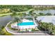 Resort-style pool and spa area with lush landscaping at 10530 Boardwalk Loop # 304, Lakewood Ranch, FL 34202