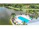 Community pool with plenty of lounge chairs and a spa at 10530 Boardwalk Loop # 304, Lakewood Ranch, FL 34202
