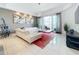 Spacious living room with white sectional sofa and large windows at 10530 Boardwalk Loop # 304, Lakewood Ranch, FL 34202
