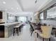 Open concept dining area with modern table and chairs, adjacent to kitchen at 10530 Boardwalk Loop # 304, Lakewood Ranch, FL 34202