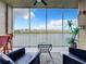 Relaxing screened balcony overlooking a lake with tranquil water views at 10530 Boardwalk Loop # 304, Lakewood Ranch, FL 34202