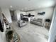 Open living room with gray sofas and modern decor at 10922 Brightleaf Ct, Riverview, FL 33569