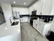 Modern kitchen featuring white cabinets and quartz countertops at 10922 Brightleaf Ct, Riverview, FL 33569
