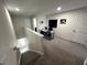 Upstairs loft area, perfect for an office, with a desk and plenty of natural light at 10922 Brightleaf Ct, Riverview, FL 33569