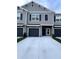 Modern gray two-story townhome with two-car garage at 10922 Brightleaf Ct, Riverview, FL 33569