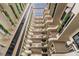 Interior view of a multi-story atrium with balconies, plants, and a glass ceiling at 2413 Bayshore Blvd # 1404, Tampa, FL 33629