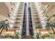 Interior view of atrium featuring a fountain, a glass elevator, and lush landscaping at 2413 Bayshore Blvd # 1404, Tampa, FL 33629