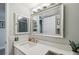 Bathroom vanity featuring a white countertop, large mirror, and updated fixtures at 2413 Bayshore Blvd # 1404, Tampa, FL 33629