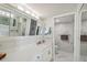 Elegant bathroom with quartz vanity, and a glass enclosed marble tiled shower and water closet at 2413 Bayshore Blvd # 1404, Tampa, FL 33629