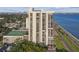 Exterior view of a high-rise building with tennis courts, a pool, and city views at 2413 Bayshore Blvd # 1404, Tampa, FL 33629