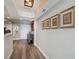 Inviting hallway featuring neutral walls, wood floors, and decorative artwork; enhanced by modern lighting and sophisticated decor at 2413 Bayshore Blvd # 1404, Tampa, FL 33629