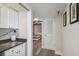 Hallway leads to a guest bedroom with a comfortable Murphy bed at 2413 Bayshore Blvd # 1404, Tampa, FL 33629