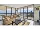 The sun-drenched living room features expansive windows, a city view, and comfortable seating at 2413 Bayshore Blvd # 1404, Tampa, FL 33629