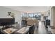 Bright living room showcasing city views, neutral furniture, and an open layout adjoining the dining area at 2413 Bayshore Blvd # 1404, Tampa, FL 33629