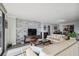 Open-concept living room boasts stylish brick accent wall, city view and natural light at 2413 Bayshore Blvd # 1404, Tampa, FL 33629