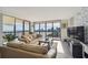 Bright living room offers amazing waterfront views and a stone accent wall at 2413 Bayshore Blvd # 1404, Tampa, FL 33629