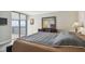 A soothing main bedroom with balcony access boasts ample natural light at 2413 Bayshore Blvd # 1404, Tampa, FL 33629