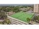 Aerial view of rooftop tennis courts with green surface surrounded by city views at 2413 Bayshore Blvd # 1404, Tampa, FL 33629