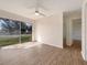 Bright bedroom with sliding glass doors opening to backyard view at 8381 Chelsea Ct, North Port, FL 34287