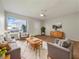 Bright living room with mid-century modern furniture at 8381 Chelsea Ct, North Port, FL 34287