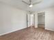 Spacious bedroom with wood-look floors and ceiling fan at 8381 Chelsea Ct, North Port, FL 34287