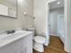 Updated bathroom with white vanity, toilet and shower/tub combo at 8381 Chelsea Ct, North Port, FL 34287