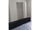 Simple bedroom with a double bed and a closet at 3023 W Green St, Tampa, FL 33607